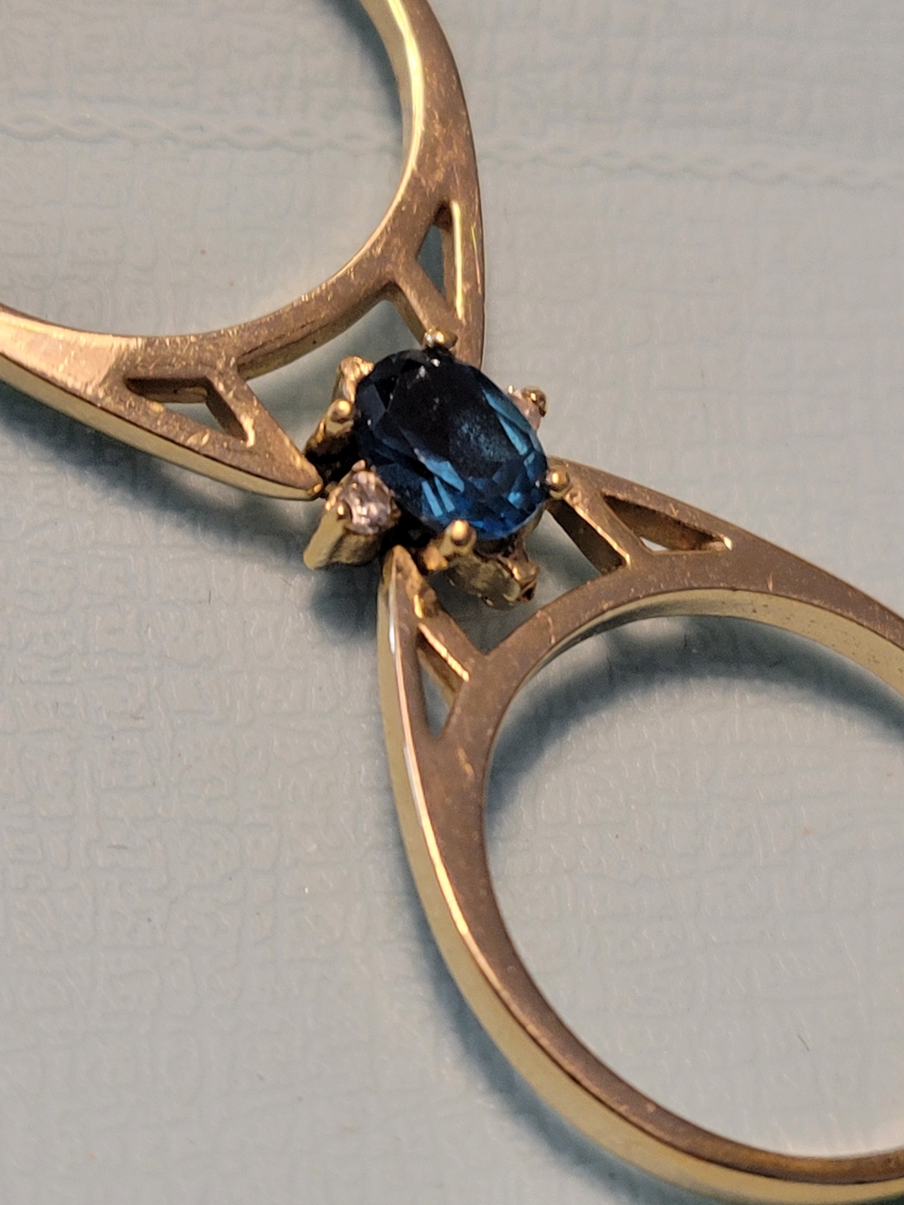 Goldtone Ring with Deep Blue Oval Sapphire In Color